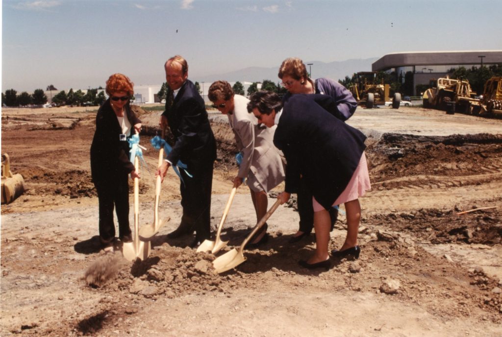 Five people, four women including Susan Hammer and Cisco CEO John Chambers, break ground on the San Jose campus with shovels